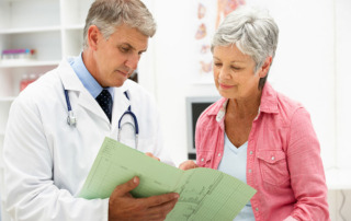 Senior woman talking with doctor