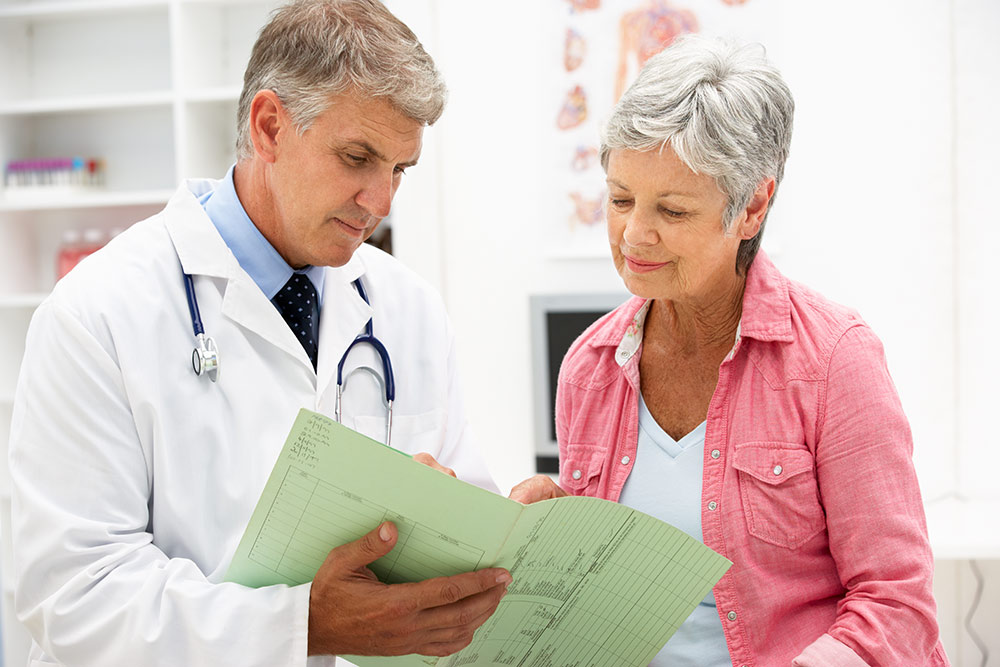 Senior woman talking with doctor